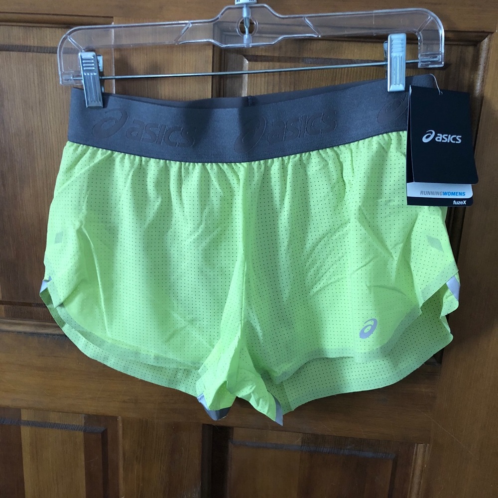 Brand new!!!!  ASICS yellow running shorts